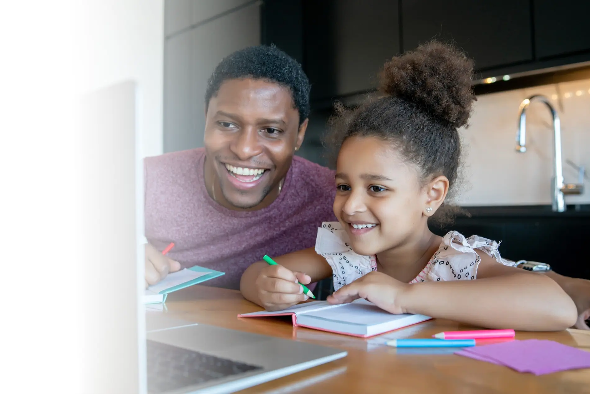 Parent helping child with learning activities